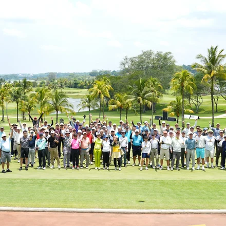 Group photo of Charity Golf participants on the course