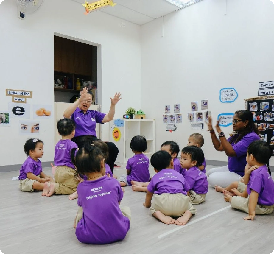 New Life Preschool teachers leading a class activity with toddlers